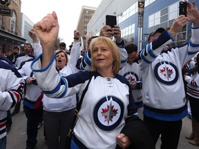 Fans cheer at the Winnipeg Whiteout Street Party on Donald Street on Wed., April 11, 2018. Kevin King/Winnipeg Sun/Postmedia Network