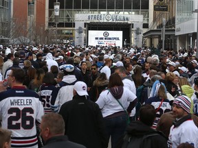 People crowd Donald Street for the Winnipeg Whiteout Street Party on Wed., April 11, 2018. Kevin King/Winnipeg Sun/Postmedia Network