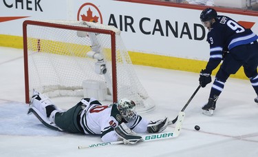 Winnipeg Jets forward Andrew Copp can't beat Minnesota Wild goaltender Devan Dubnyk from a sharp angle during Game 1 of their first-round NHL playoff series in Winnipeg on Wed., April 11, 2018. Kevin King/Winnipeg Sun/Postmedia Network