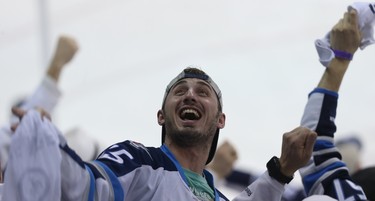 A Winnipeg Jets fan celebrates during Game 1 of the first-round NHL playoff series against the Minnesota Wild in Winnipeg on Wed., April 11, 2018. Kevin King/Winnipeg Sun/Postmedia Network