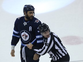 Winnipeg Jets defenceman Dustin Byfuglien is separated from a scrum during Game 2 of their first-round NHL playoff series against the Minnesota Wild in Winnipeg on Friday.