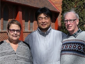 (Left to right) Rev. Janet Walker, Korean United Church minister Kwang beam Cho and caretaker Wayne Arklie pose at Churchill Park United Church, where plans are in place to install a solar panels on the roof.