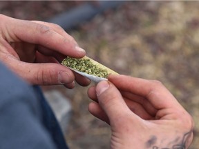 A marijuana joint is rolled during the 4/20 event on the Manitoba Legislative Building grounds in Winnipeg.