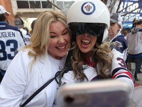 Fans take a selfie during the Whiteout Street Party outside Bell MTS Centre in Winnipeg on Fri., April 20, 2018. Kevin King/Winnipeg Sun/Postmedia Network