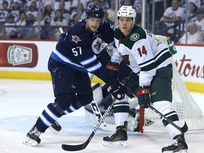 Winnipeg Jets defenceman Tyler Myers (left) missed all but 11 games with injuries last season, but has been a workhorse this year, mostly on a third defensive pairing with Ben Chiarot.