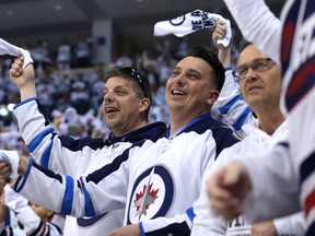 Winnipeg Jets fans celebrate a goal against the Minnesota Wild during Game 5 on Friday.