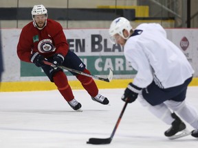 Toby Enstrom (left) dishes to Paul Stastny during Winnipeg Jets practice at Bell MTS Iceplex in Winnipeg on Tues., April 24, 2018. Kevin King/Winnipeg Sun/Postmedia Network