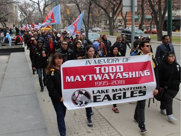 The annual National Day of Mourning Safe Workers of Tomorrow Leaders' Walk for workers killed, injured or became ill due to workplace hazards and incidents heads down Broadway towards Memorial Park in Winnipeg on Friday, April 27, 2018. The walk was led by the family of Todd Maytwayashing, a 22-year-old from Lake Manitoba First Nation who was killed in January while working as a Manitoba Hydro contractor near Gillam. The 21st annual walk was culminated with a reading of the names of the 27 workers killed in 2017 and the official ground-breaking for the Manitoba Workers' Memorial to honour Manitoba firefighters, peace officers, and workers who have lost their lives while at work.