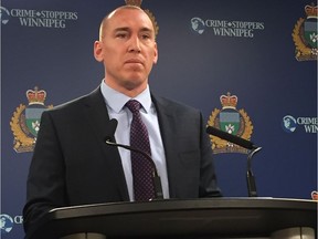 Sgt. Shaun Veldman of the Winnipeg Police Service Financial Crimes Unit addresses the media at a briefing at police headquarters on Monday, to announce the arrest of former funeral director Mike Knysh and that fraud and forgery charges have been laid against him for fraudulent selling of prearranged funeral plans.