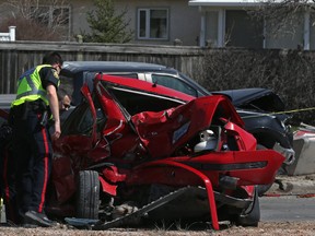 Police investigate a motor vehicle collision on Roblin Boulevard, west of where it intersects Dale and Barker boulevards, in Winnipeg on Sunday, April 29, 2018. The 19-year-old driver of the pickup truck involved in the crash has been charged with impaired driving causing bodily harm and dangerous driving.