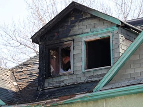 The top floor of a rooming house on Lily Street, near the Disraeli Freeway, scene of a fire early Sunday morning.