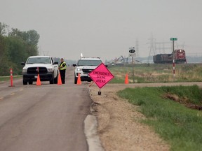 Highway 221 east of Rosser is closed due to a Canadian Pacific Railway freight train which derailed west of Winnipeg, Man., apparently during a thunderstorm on Tuesday, May 29, 2018. (Brook Jones/Stonewall Argus & Teulon Times/Postmedia Network)  The company says 13 train cars went off the tracks around 6 p.m. Tuesday near Rosser.
