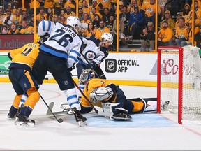 NASHVILLE, TN - MAY 05:  Blake Wheeler #26 of the Winnipeg Jets watches as teammate Kyle Connor #81 scores a goal against goalie Pekka Rinne #35 of the Nashville Predators during the second period of Game Five of the Western Conference Second Round during the 2018 NHL Stanley Cup Playoffs at Bridgestone Arena on May 5, 2018 in Nashville, Tennessee.  (Photo by Frederick Breedon/Getty Images)