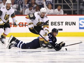 WINNIPEG, MB - MAY 12:  Reilly Smith #19 of the Vegas Golden Knights skates past Nikolaj Ehlers #27 of the Winnipeg Jets during the third period in Game One of the Western Conference Finals during the 2018 NHL Stanley Cup Playoffs at Bell MTS Place on May 12, 2018 in Winnipeg, Canada. The Winnipeg Jets defeated the Vegas Golden Knights 4-2.  (Photo by Elsa/Getty Images)