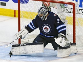 WINNIPEG, MB - MAY 14: Connor Hellebuyck #37 of the Winnipeg Jets stops a shot against the Vegas Golden Knights during the first period in Game Two of the Western Conference Finals during the 2018 NHL Stanley Cup Playoffs at Bell MTS Place on May 14, 2018 in Winnipeg, Canada.  (Photo by Jason Halstead/Getty Images)