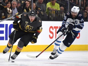 LAS VEGAS, NV - MAY 16: Nate Schmidt #88 of the Vegas Golden Knights is pursued by Blake Wheeler #26 of the Winnipeg Jets during the second period in Game Three of the Western Conference Finals during the 2018 NHL Stanley Cup Playoffs at T-Mobile Arena on May 16, 2018 in Las Vegas, Nevada.