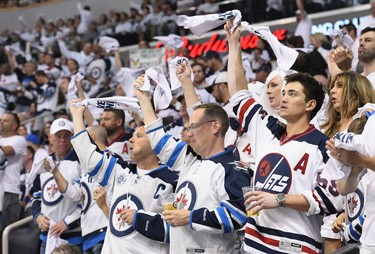 WINNIPEG, MB - MAY 20:  Winnipeg Jets fans cheer during Game Five of the Western Conference Finals between the Vegas Golden Knights and the Winnipeg Jets during the 2018 NHL Stanley Cup Playoffs at Bell MTS Place on May 20, 2018 in Winnipeg, Canada.  (Photo by David Lipnowski/Getty Images)