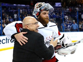Braden Holtby and head coach Barry Trotz of the Washington Capitals celebrate after defeating the Tampa Bay Lightning in Game 7 of the Eastern Conference final on May 23, 2018 in Tampa, Florida.