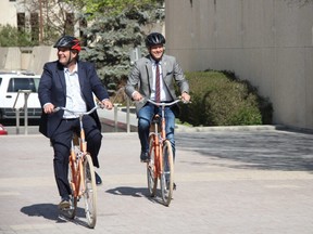 Downtown Winnipeg BIZ CEO Stefano Grande (left) and Winnipeg Mayor Brian Bowman (right) try out the new bikes during the announcement of Pedal in the Peg, a new bike-sharing service in downtown Winnipeg on may 16, 2018.
Danton Unger/Winnipeg Sun