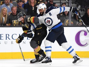 James Neal of the Vegas Golden Knights skates against Dustin Byfuglien of the Winnipeg Jets  at T-Mobile Arena on May 18, 2018 in Las Vegas. (Harry How/Getty Images)