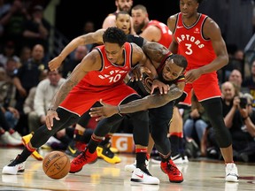 LeBron James of the Cleveland Cavaliers battles with DeMar DeRozan of the Toronto Raptors during the second half in Game 3 of the Eastern Conference Semifinals during the 2018 NBA Playoffs at Quicken Loans Arena on May 5, 2018 in Cleveland, Ohio.