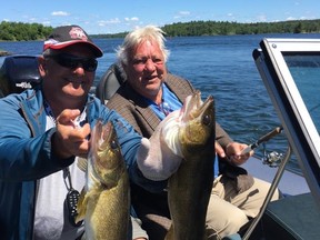 Dave DeVries and Bobby Hull and Dave DeVries each hold a couple of a big walleye snags. Supplied photo.