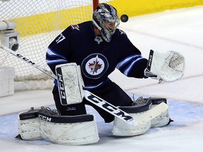 A Vegas Golden Knights shot gets past Winnipeg Jets goaltender Connor Hellebuyck before hitting the post during Game 2 of the Western Conference final in Winnipeg on Mon., May 14, 2018. (Kevin King/Winnipeg Sun)