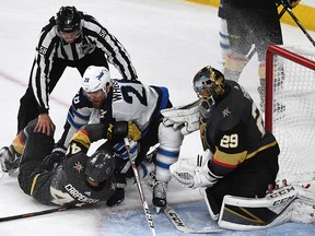 Ryan Carpenter of the Vegas Golden Knights and Blake Wheeler of the Winnipeg Jets get tangled up iun front of Marc-Andre Fleury at T-Mobile Arena on May 18, 2018 in Las Vegas. (Ethan Miller/Getty Images)