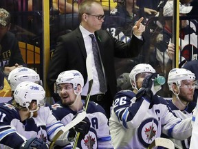Winnipeg Jets coach Paul Maurice gestures to his team during the third period in Game 5 of an NHL hockey second-round playoff series against the Nashville Predators, Saturday, May 5, 2018, in Nashville, Tenn. The Jets won 6-2 to take a 3-2 lead in the series. (AP Photo/Mark Humphrey) ORG XMIT: TNMH127