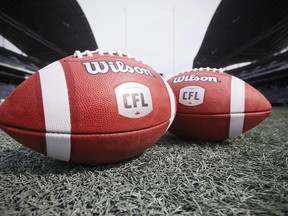 New CFL balls are photographed at the Winnipeg Blue Bombers stadium in Winnipeg Thursday, May 24, 2018. CFL quarterbacks, receivers and running backs players have spent training camp adapting to the new ball introduced for the 2018 season. The new version has harder leather and is minutely larger around than the previous ball. Some players notice a difference, but others don't. THE CANADIAN PRESS/John Woods