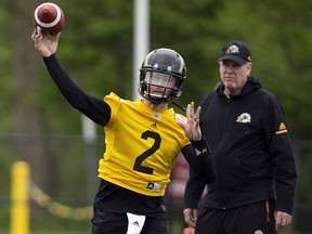 Quarterback Johnny Manziel (2) throws a pass at McMaster University during the Tiger Cats training camp in Hamilton Sunday, May 20, 2018. (THE CANADIAN PRESS/Peter Power)