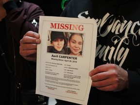 A spokesperson for the family of April Carpenter holds a missing persons poster loved ones created during their search for the missing woman, while speaking to media at the Manitoba Legislature on Thursday, May 17, 2018. Carpenter, 23, was found deceased in the Red River after being reported missing weeks earlier, her family says. Her loved ones are now calling on anyone with information on the days leading up to her death to come forward. 
JOYANNE PURSAGA/Winnipeg Sun