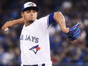 Toronto Blue Jays closer Roberto Osuna pitches against the Milwaukee Brewers in Toronto on Tuesday, April 11, 2017. (THE CANADIAN PRESS/Nathan Denette)