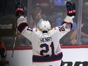 REGINA, SASK :  May 23, 2018  --  Host Regina Pats forward Nick Henry (21) celebrates his second period goal during the 100th anniversary of the Memorial Cup at the Brandt Centre in Regina. TROY FLEECE / Regina Leader-Post