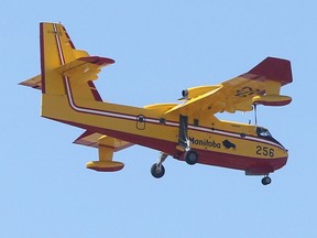 A water bomber in the air over Winnipeg.  Saturday, April 15, 2017.   Sun/Postmedia Network