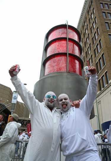 William (left) and A.J. Bartel celebrate in front of a giant Bud Red Light on Donald Street at Graham Avenue before the Winnipeg Jets met the Nashville Predators in Game 2 of their second-round playoff series in Winnipeg on Tues., May 1, 2018. Kevin King/Winnipeg Sun/Postmedia Network