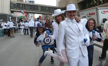 Rob Magnusson (right) and girlfriend Viola Bauer pose for a photo during the street party before the Winnipeg Jets faced the Nashville Predators in Game 2 of their second-round playoff series in Winnipeg on Tues., May 1, 2018. Kevin King/Winnipeg Sun/Postmedia Network