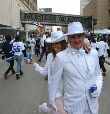 Rob Magnusson (right) and girlfriend Viola Bauer pose for a photo during the street party before the Winnipeg Jets faced the Nashville Predators in Game 2 of their second-round playoff series in Winnipeg on Tues., May 1, 2018. Kevin King/Winnipeg Sun/Postmedia Network