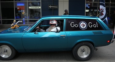Dan Nolin rolls down Hargrave Street in a decorated Chevy Vega wagon before the Winnipeg Jets took on the Nashville Predators in Game 2 of their second-round playoff series in Winnipeg on Tues., May 1, 2018. Kevin King/Winnipeg Sun/Postmedia Network