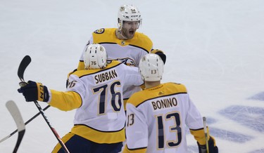Nashville Predators forward Austin Watson (top) celebrates his goal against the Winnipeg Jets during Game 2 of their second-round playoff series in Winnipeg with P.K. Subban and Nick Bonino on Tues., May 1, 2018. Kevin King/Winnipeg Sun/Postmedia Network