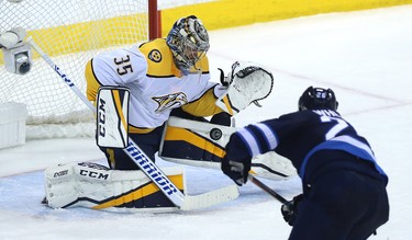 Nashville Predators goaltender Pekka Rinne makes a save on Winnipeg Jets forward Blake Wheeler during Game 2 of their second-round playoff series in Winnipeg on Tues., May 1, 2018. Kevin King/Winnipeg Sun/Postmedia Network