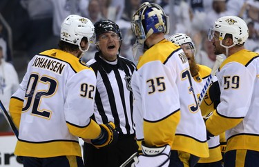 Referee Brad Watson barks at Nashville Predators goaltender Pekka Rinne as he argues a penalty call against him late during Game 2 of their second-round playoff series against the Winnipeg Jets in Winnipeg on Tues., May 1, 2018. Kevin King/Winnipeg Sun/Postmedia Network
