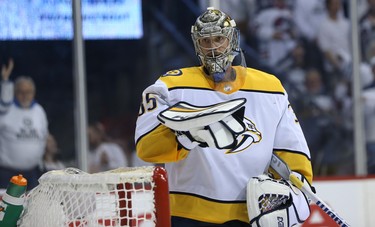 Nashville Predators goaltender Pekka Rinne takes a breather during Game 2 of their second-round playoff series against the Winnipeg Jets in Winnipeg on Tues., May 1, 2018. Kevin King/Winnipeg Sun/Postmedia Network