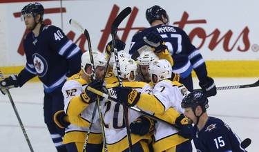 The Nashville Predators celebrate a goal from Ryan Hartman during Game 4 of their second-round NHL playoff series against the Winnipeg Jets in Winnipeg on Thurs., May 3, 2018. Kevin King/Winnipeg Sun/Postmedia Network