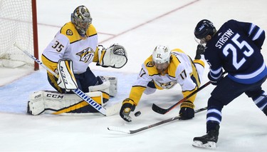 Nashville Predators forward Scott Hartnell (centre) dives to block a shot from Winnipeg Jets centre Paul Stastny during Game 4 of their second-round NHL playoff series in Winnipeg on Thurs., May 3, 2018. Kevin King/Winnipeg Sun/Postmedia Network