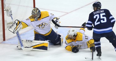 Nashville Predators goaltender Pekka Rinne throws his blocker at a shot from Winnipeg Jets centre Paul Stastny during Game 4 of their second-round NHL playoff series in Winnipeg on Thurs., May 3, 2018. Kevin King/Winnipeg Sun/Postmedia Network