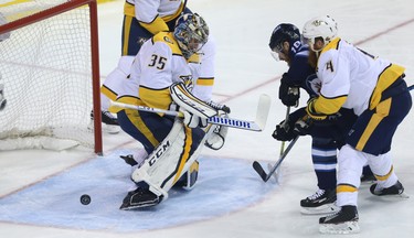 Winnipeg Jets forward Bryan Little has his shot stopped by Nashville Predators goaltender Pekka Rinne during Game 4 of their second-round NHL playoff series in Winnipeg on Thurs., May 3, 2018. Kevin King/Winnipeg Sun/Postmedia Network