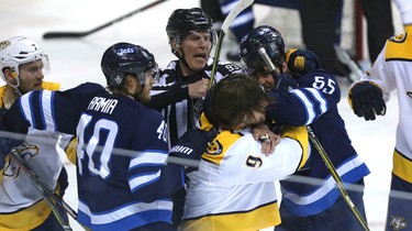 Winnipeg Jets centre Mark Scheifele (right) and Nashville Predators forward Filip Forsberg get into it during Game 4 of their second-round NHL playoff series in Winnipeg on Thurs., May 3, 2018. Kevin King/Winnipeg Sun/Postmedia Network