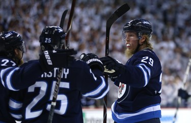 Winnipeg Jets forward Patrik Laine (right) celebrates his goal late in the third period against the Nashville Predators during Game 4 of their second-round NHL playoff series in Winnipeg with Nikolaj Ehlers (left) and Paul Stastny on Thurs., May 3, 2018. Kevin King/Winnipeg Sun/Postmedia Network