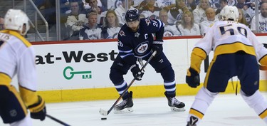 Winnipeg Jets forward Blake Wheeler (centre) sets up in the Nashville Predators end with the Jets net empty during Game 4 of their second-round NHL playoff series in Winnipeg on Thurs., May 3, 2018. Kevin King/Winnipeg Sun/Postmedia Network